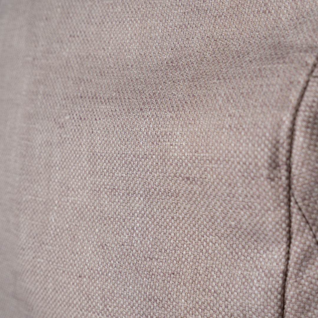 Close-up of a woven fabric texture in a light taupe-beige color with a visible seam on the right side. Sand Copenhagen Blazers available at Sakks Menswear in Southampton.
