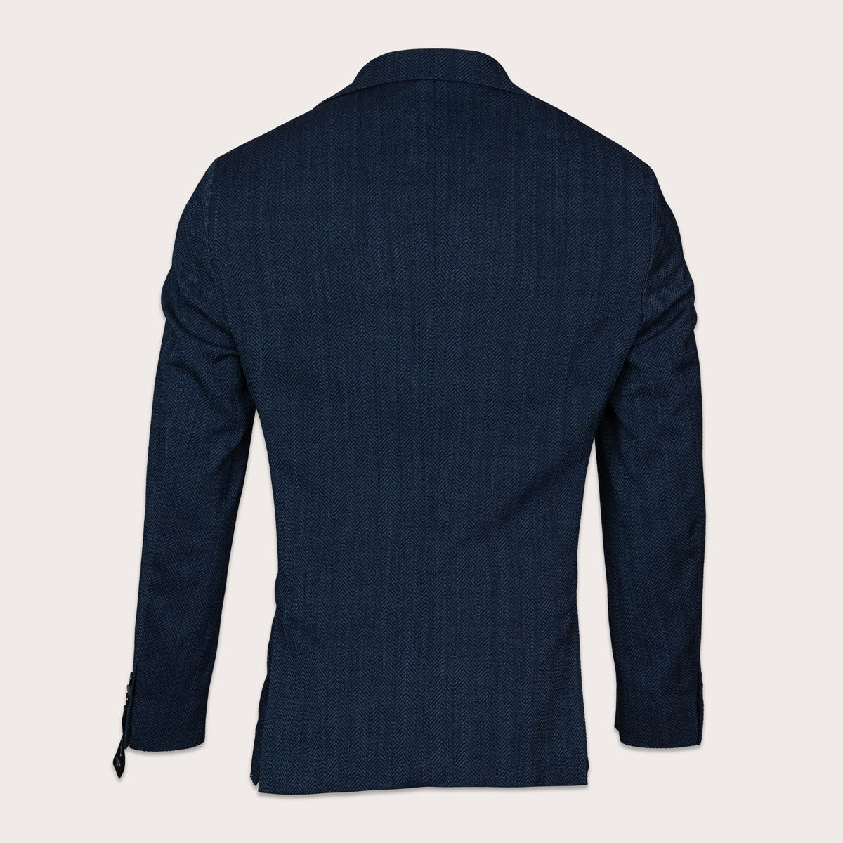 The back view of a men's dark navy blue textured blazer, displayed on a clean, solid off-white background. Sand Copenhagen Blazers available at Sakks Menswear in Southampton.