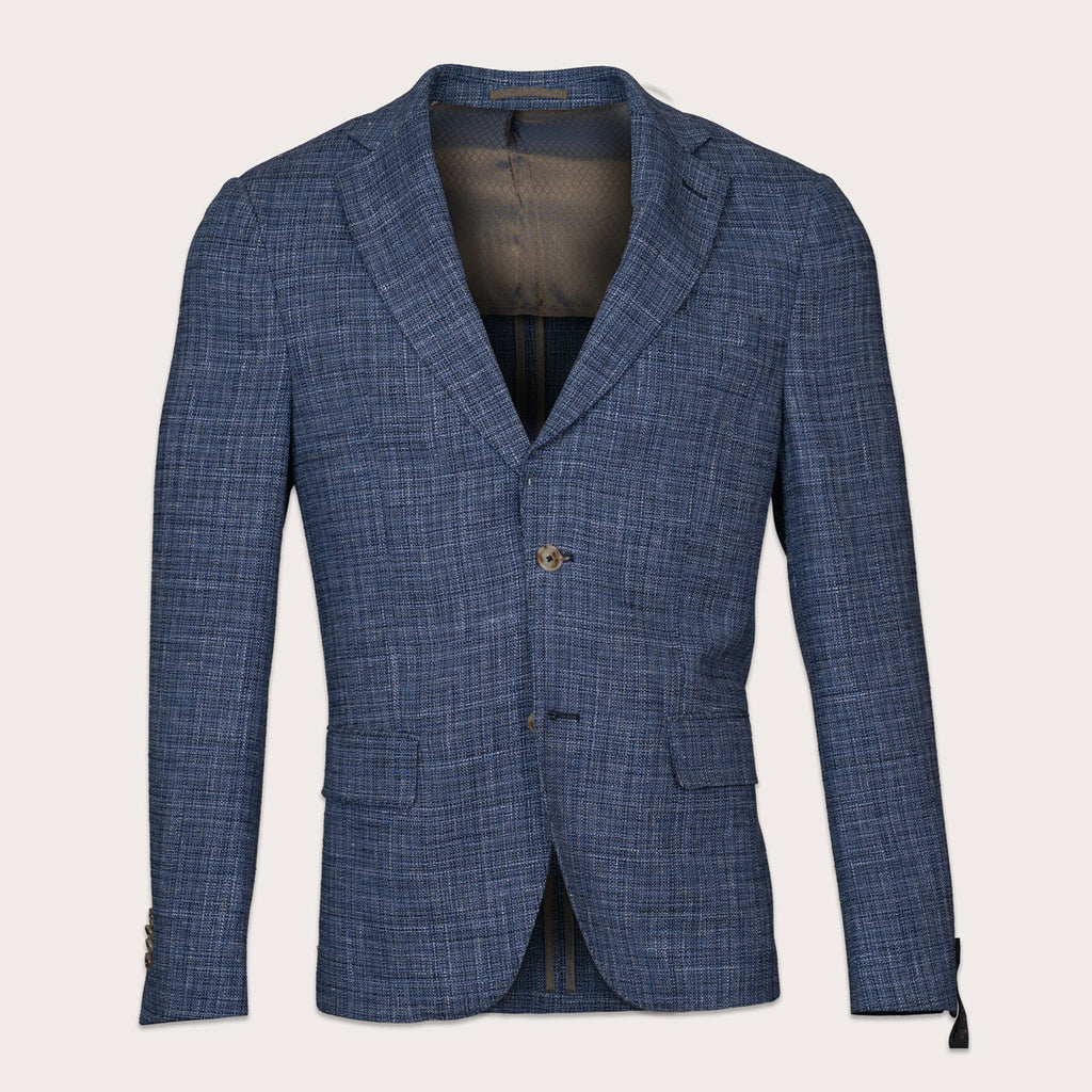 A blue textured blazer with a subtle plaid pattern, featuring notch lapels, a two-button closure, and front flap pockets, shown against a light beige background. Sand Copenhagen Blazers available at Sakks Menswear in Southampton.
