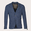 A blue textured blazer with a subtle plaid pattern, featuring notch lapels, a two-button closure, and front flap pockets, shown against a light beige background. Sand Copenhagen Blazers available at Sakks Menswear in Southampton.