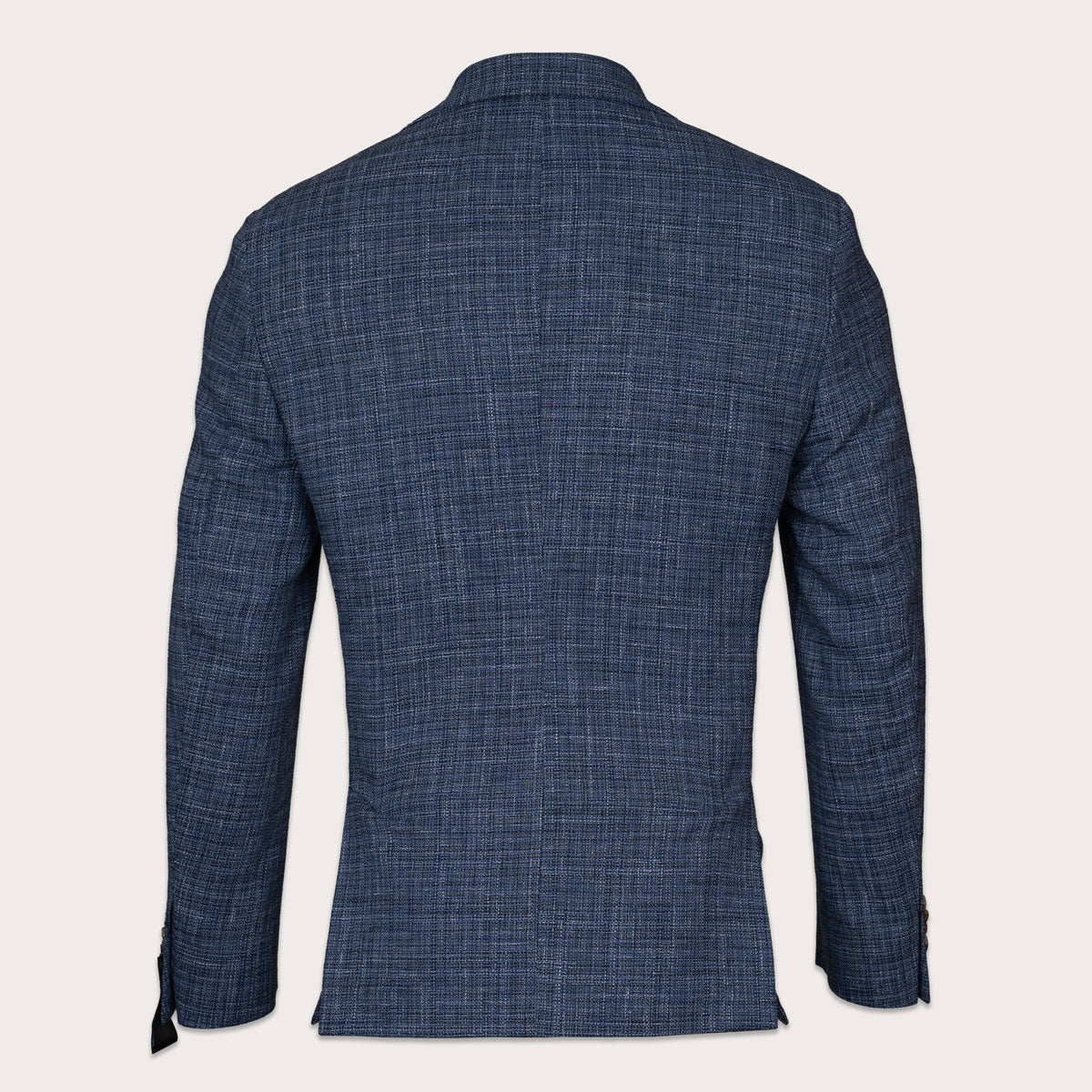 A men's navy blue textured blazer shown from the back, featuring a subtle woven grid pattern and a classic collar, set against a solid off-white background. Sand Copenhagen Blazers available at Sakks Menswear in Southampton.