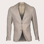 A light beige textured linen blazer with notched lapels and two brown buttons, displayed on a mannequin against a light cream background. Sand Copenhagen Blazer available at Sakks Menswear in Southampton.