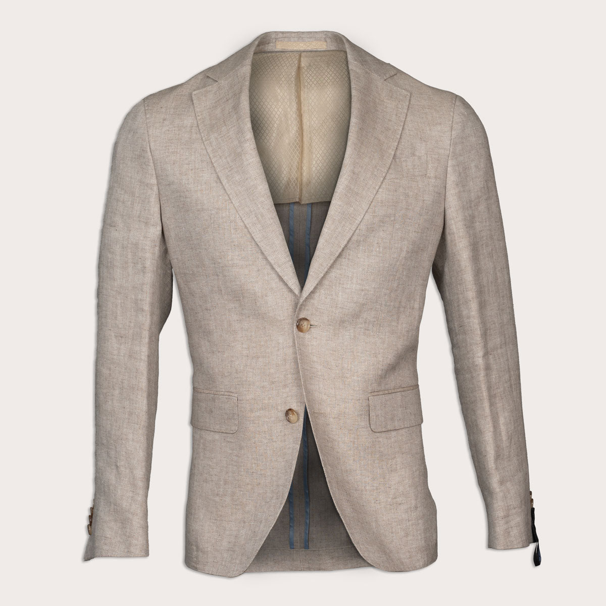 A light beige textured linen blazer with notched lapels and two brown buttons, displayed on a mannequin against a light cream background. Sand Copenhagen Blazer available at Sakks Menswear in Southampton.