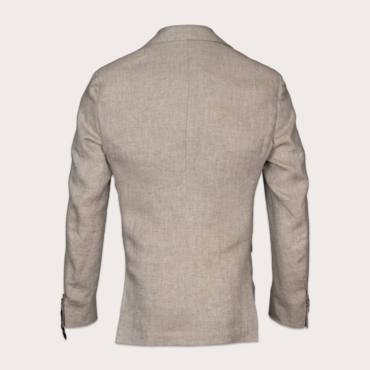 A light beige textured blazer shown from the back, featuring a clean collar, long sleeves, and subtle button details on the cuffs, set against a solid off-white background. Sand Copenhagen Blazer available at Sakks Menswear in Southampton.