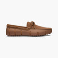 A single brown leather driving loafer with a woven toe cap and matching laces, shown in a side profile on a light gray background. SWIMS Loafers available at Sakks Menswear in Southampton.