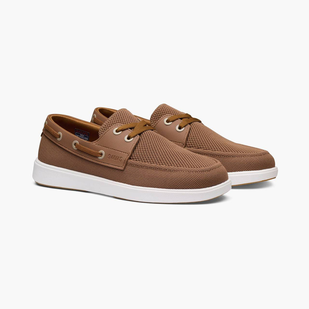 Pair of beige loafers on a white background. SWIMS Boat Shoes available at Sakks Menswear in Southampton.