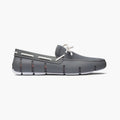 Brown slip-on shoe with white sole on a white background. SWIMS Loafers available at Sakks Menswear in Southampton.