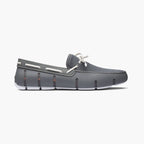 Brown slip-on shoe with white sole on a white background. SWIMS Loafers available at Sakks Menswear in Southampton.