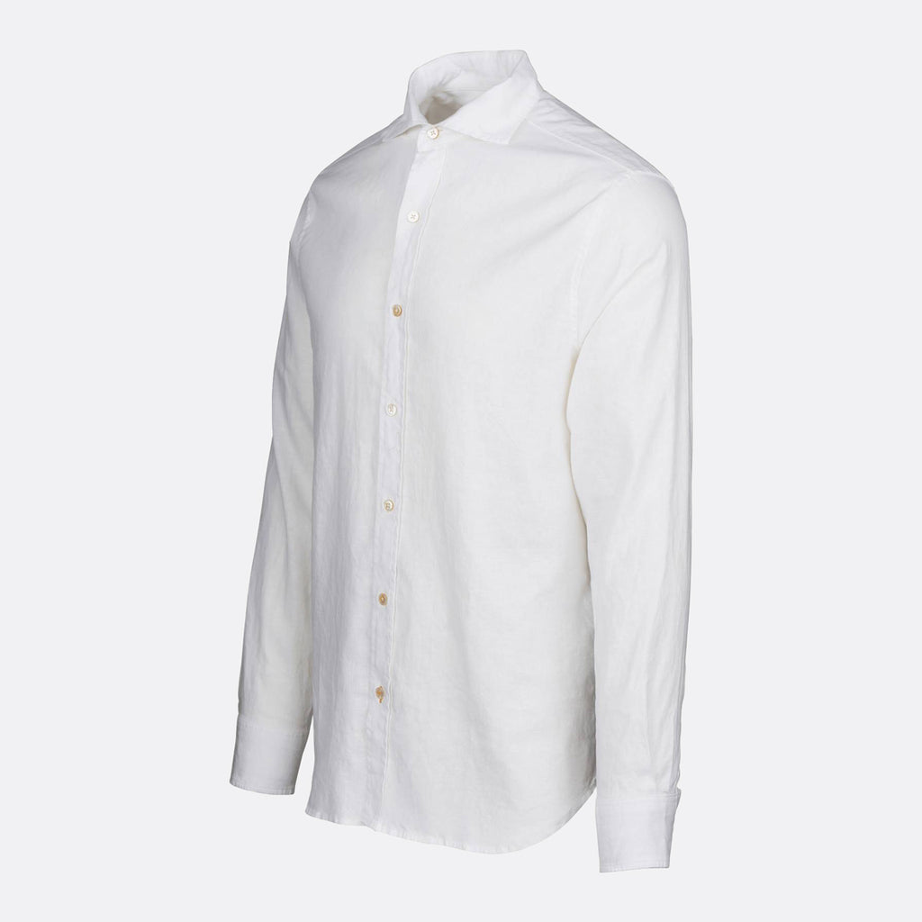 A white long-sleeve button-down shirt with a pointed collar and light-colored buttons, shown on a light gray background. SWIMS Shirt available at Sakks Menswear in Southampton.