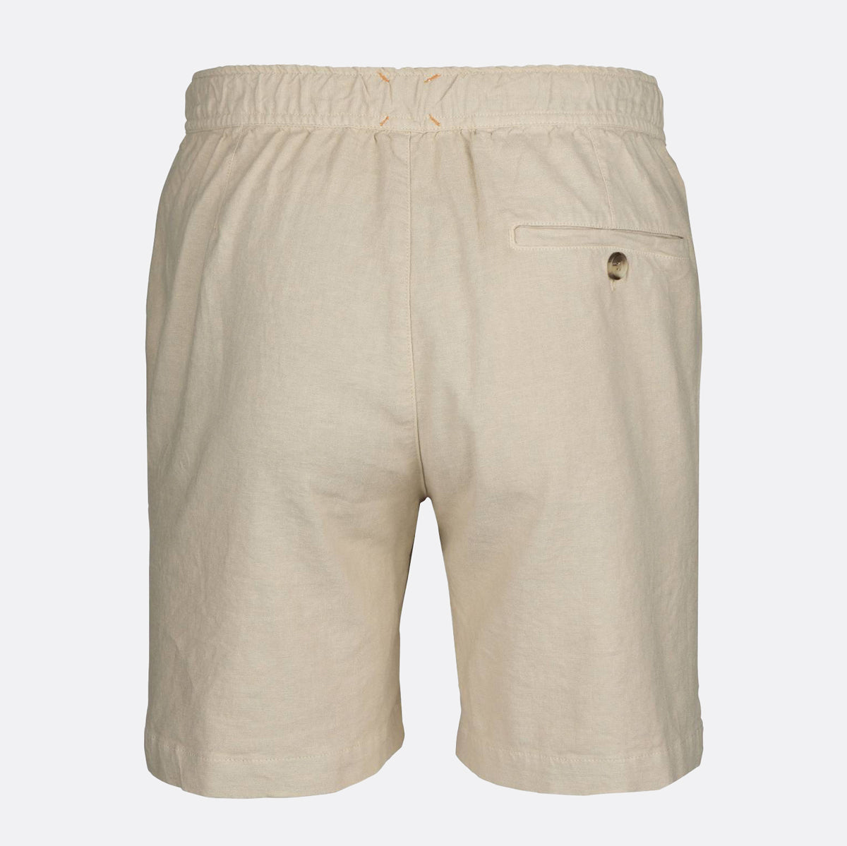 Beige linen shorts with an elastic waistband, a side welt pocket, and a small button closure, shown from the back on a light gray background. SWIMS Shorts available at Sakks Menswear in Southampton.