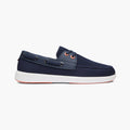 A navy blue boat shoe with a white sole and orange eyelets, shown in a side profile on a light gray background. SWIMS Boat Shoes available at Sakks Menswear in Southampton.