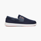 A navy blue boat shoe with a white sole and orange eyelets, shown in a side profile on a light gray background. SWIMS Boat Shoes available at Sakks Menswear in Southampton.