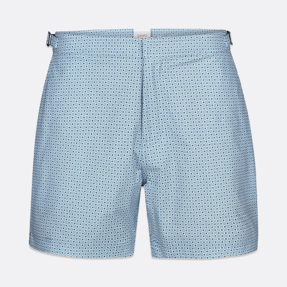 Light blue shorts with a small repeating dark blue geometric pattern, shown flat against a light gray background. SWIMS Swim Shorts available at Sakks Menswear in Southampton.