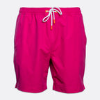 Bright pink swim trunks with a white drawstring and small orange tips, shown against a light gray background. SWIMS Swimshorts available at Sakks Menswear in Southampton.