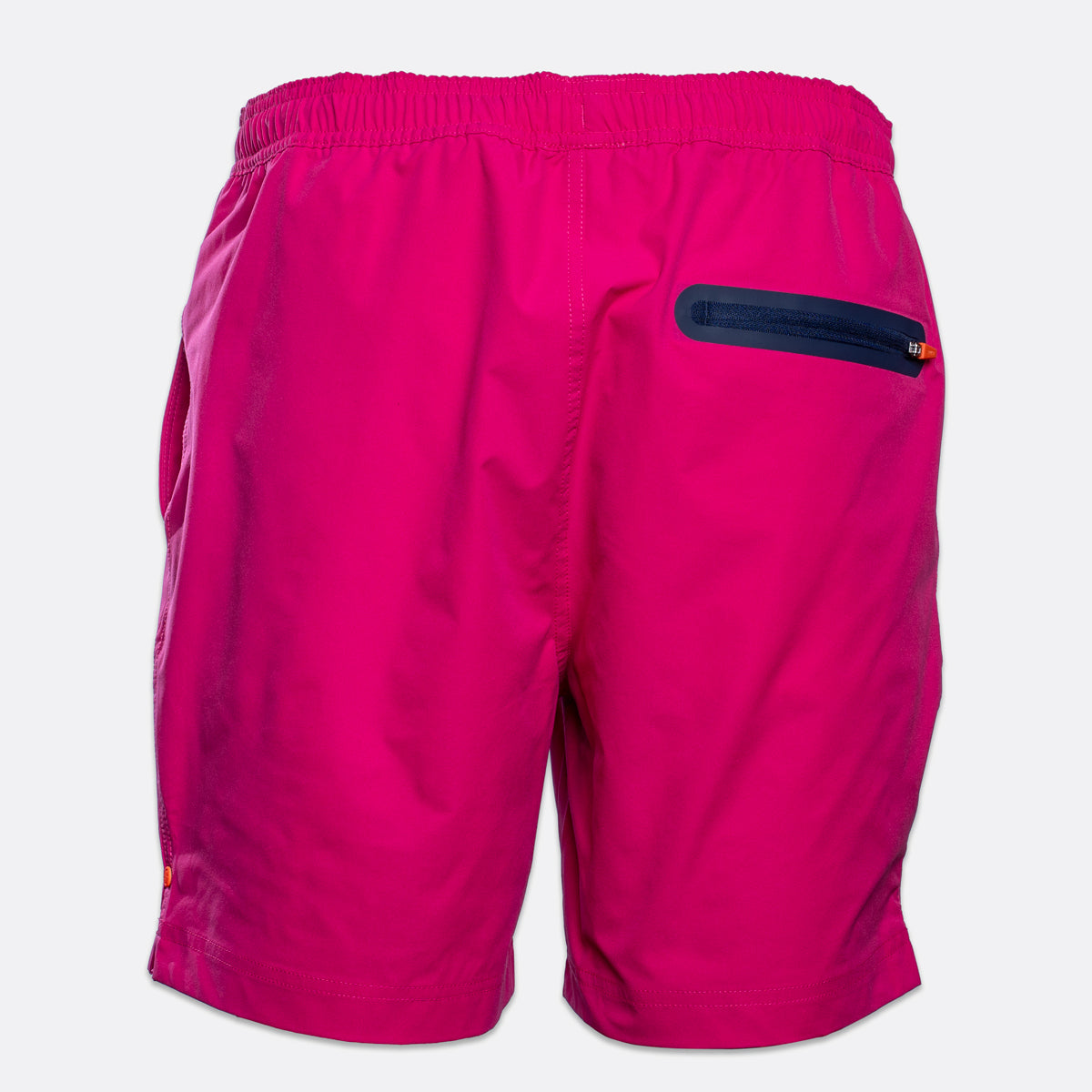 Bright pink athletic shorts with an elastic waistband and a dark navy zippered pocket on the back, shown against a light gray background. SWIMS Swimshorts available at Sakks Menswear in Southampton.