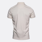The back view of a short-sleeve polo shirt in a light cream or off-white color, displayed on a clean, light gray background. Thomas Maine Polo available at Sakks Menswear in Southampton.