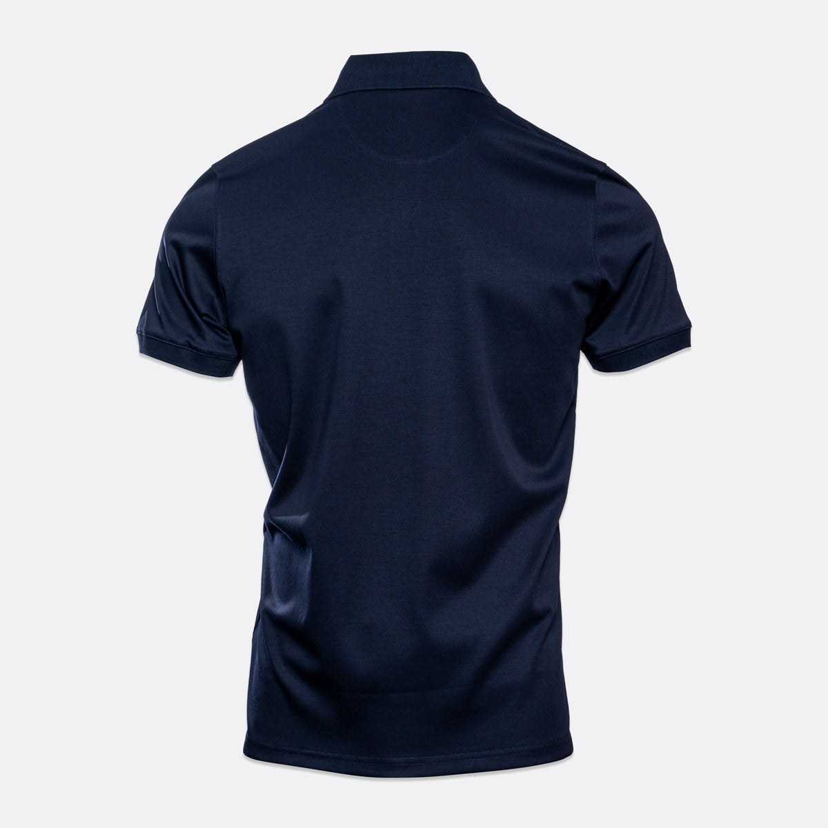 A dark navy blue short-sleeve polo shirt shown from the back, displayed on a light gray background. Thomas Maine Polo available at Sakks Menswear in Southampton.