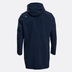 A dark navy hooded jacket shown from the back, featuring a small square logo on the upper left shoulder, set against a light gray background. UBR Jacket available at Sakks Menswear in Southampton.
