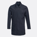 A dark navy blue utility jacket with a pointed collar, front zipper, and a small embroidered logo on the left chest, displayed on a light gray background. UBR Jacket available at Sakks Menswear in Southampton.