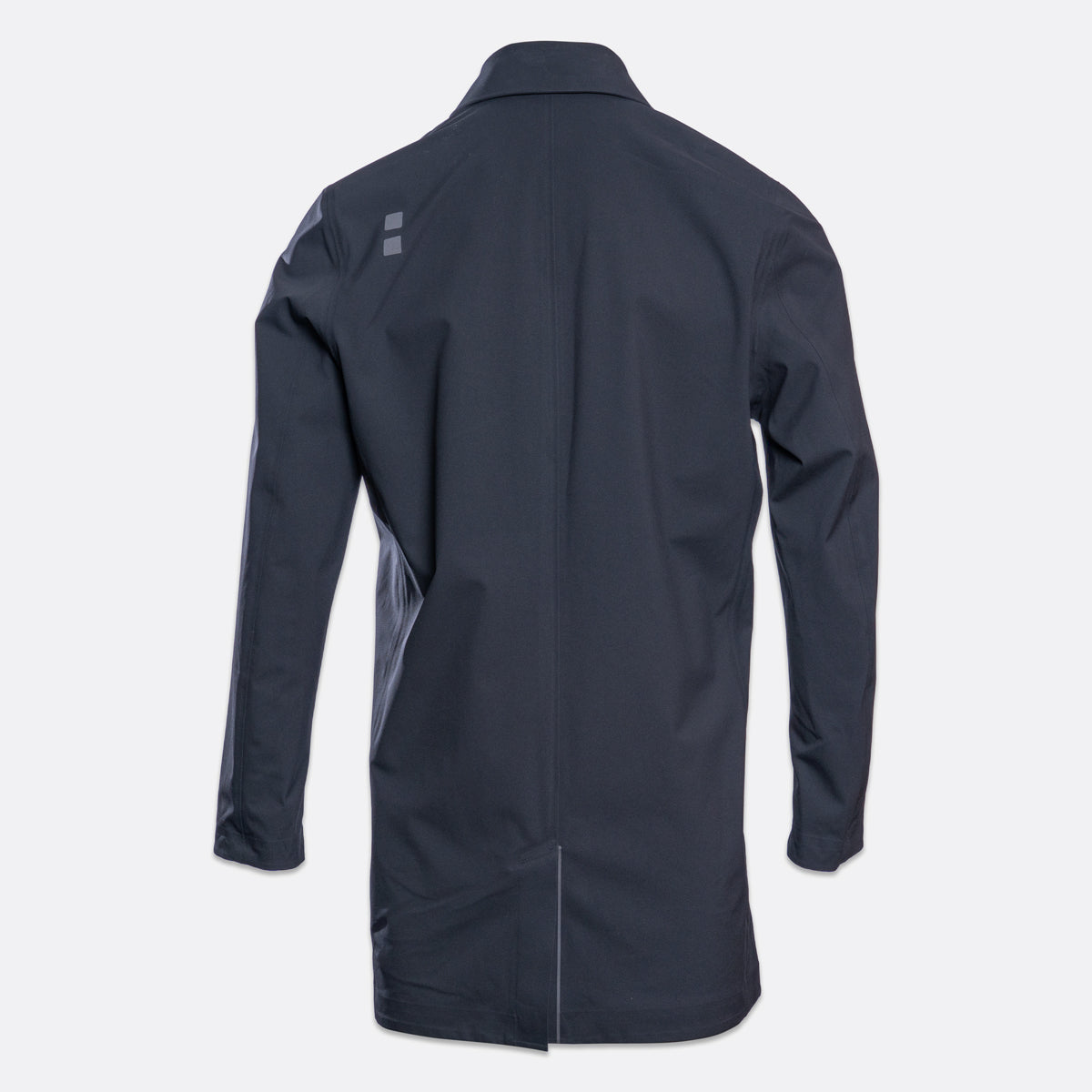 A dark navy blue long-sleeve jacket shown from the back, featuring a subtle gray geometric logo on the upper left shoulder, set against a light gray background. UBR Jacket available at Sakks Menswear in Southampton.